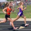 Ellie Cawyer making strides on an opponent at the sectional track meet.