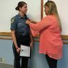 Photo courtesy Diane Helms
Jordan Welch was sworn in as a reserve officer, September 18, before the monthly city council meeting. Her mother, Patti Welch, pinned on her badge. Jordan will become the school resource officer.