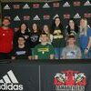 Pictured with Lamar High School Activities/Athletic Director Jared Beshore were Lamar seniors that signed to move on to the next level, back row, left to right, Abbie Ryder, Kiersten Potter, Kailey Hlavaty, Marcy Miller, Phajjia Gordon and Kennedy Evans. Seated, left to right, are Austin Wilkerson, Cameron Sturgell and Joel Beshore.