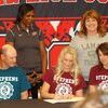 Lamar Democrat/Melody Metzger
Kelsey Taffner signed to play volleyball at Stephens College in Columbia on Wednesday, April 13. Taffner, who plans to major in fashion merchandising and management, said she chose Stephens College because they had the best program for her major and that simply enough, she liked the coach. Kelsey has been playing volleyball for the past six years. She is the daughter of Kevin and Shelby Taffner. Pictured are, sitting, left to right, Kevin Taffner, Kelsey Taffner and Shelby Taffner; back row, standing, left to right, Stephens College coach Rose Obunaga and Ann Landrum, Lamar volleyball coach.