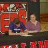 Lamar Democrat/Melody Metzger
Mark Venable signed with Southwest Baptist University in Bolivar on Wednesday afternoon, April 11. He will run cross country and track. He plans to go into the field of physical therapy. Mark is the son of Matthew and Elizabeth Venable; however, due to his father having to be at work, he is pictured with his mom as he signs his letter of intent.