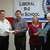 Accepting a check for Liberal were Master Bob Davis with the Lamar Masonic Lodge, Liberal School Superintendent Bill Harvey; Shanda Shaw, counselor, and Worthy Matron Judy Keener with Eastern Star.