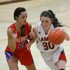 Photos by Terry Redman
No. 30 sophomore Josey Adams drives past this Patriot defender in girls basketball action in Lamar.