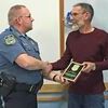 Lamar Police Chief Rusty Rives presented a plaque of appreciation to Harold VanDeMark, who served over 24 years as chairman of the Lamar City Council's Police Board. VanDeMark is retiring from the city council in April.