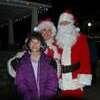 Lamar Democrat/Melody Metzger
Payton Littlejohn poses with Mr. and Mrs. Claus at the Santa Stroll and Christmas lighting ceremony held Tuesday evening, Nov. 23. Payton made sure to let Santa know just exactly what she wanted for Christmas.