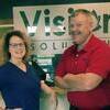 Joining the team at Vision Solutions is, left, Misty Lee and right, Brian Hartgrave.