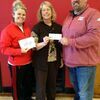 The family of Tim Forst made a donation of $5,000 to aide with the archery program, as it helps area Lamar kids succeed. Pictured are, left to right, Lamar High School Physical Education Teacher Sarah Trout, Diane Forst and West Elementary Physical Education Teacher Harvey Fry.