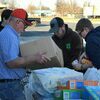 Chris Elswick worked with Kyler Cox, Noah Shaw and Blaine Shaw to sort the food that was donated to the Good Samaritan.