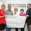 Commerce Trust Vice President Jill Reynolds, left, and CFO Board Chair Rob Foster, far right, present the grant to Allen Rice, Nancy Curless and Judy Rice.