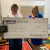Jody Lindsey (left) will use the $210 grant to purchase sensory seating and floor and wall manipulatives to help meet the emotional and social needs of her students. She is pictured with a check that was presented by Dr. Angie Besendorfer (right), chancellor of WGU Missouri, on May 3, at Bronaugh Elementary School.