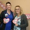Cox Barton County Hospital staff will be selling $2 paper hearts throughout the month of February. Pictured, left to right, are Chelle Gardner and Nico Lindsteadt.