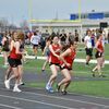 Josey Adams delivers the baton to Kaitlyn Davis during the 4x800 meter relay at the Carthage Invitational on March 28. The Lady Tigers (Adams, Davis, Jordan Lee and Kara Morey) medaled third in the event. Adams also placed eighth in the 400 meter dash.