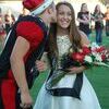 Lamar senior quarterback and 2017 homecoming king Stuart McKarus kisses the cheek of queen Darrah Bartlett prior to the Tigers route of McDonald County.