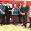 Accepting the check on behalf of Lamar schools were, left to right, Director of Special Services Piper Stewart, Joe Willis and Pat Willis, Social Worker Kristina Forst, School Nurse Diana Ball, Jerry Stepp and Randy McGee.